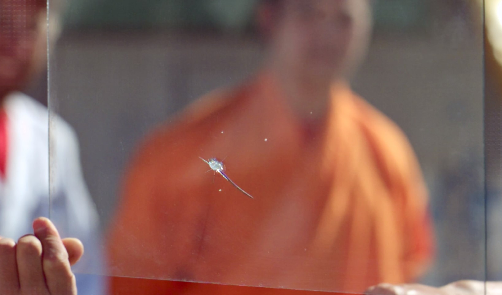 Man Throws Needle Through Glass